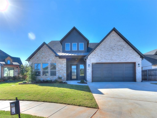 view of front facade with a garage and a front lawn