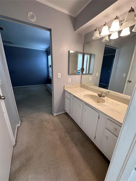 bathroom with vanity and ornamental molding