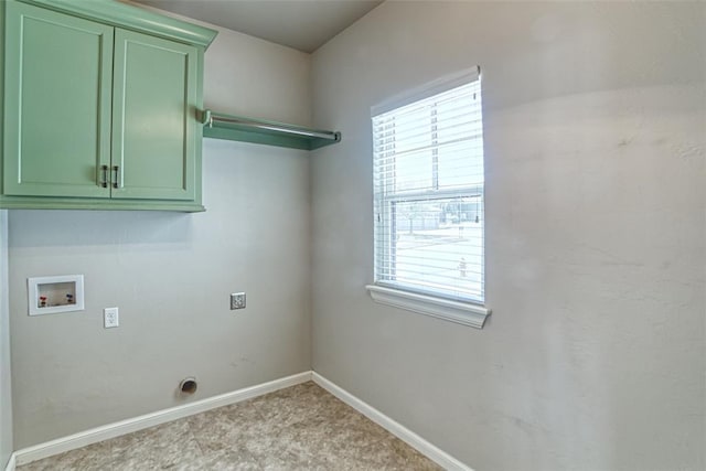 laundry room with baseboards, hookup for a washing machine, cabinet space, and light colored carpet