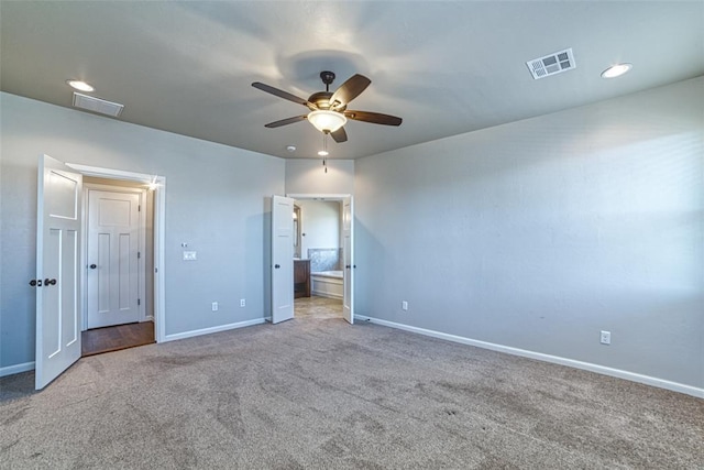 unfurnished bedroom with visible vents, carpet, and baseboards