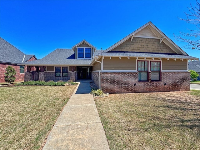 craftsman house with brick siding and a front lawn