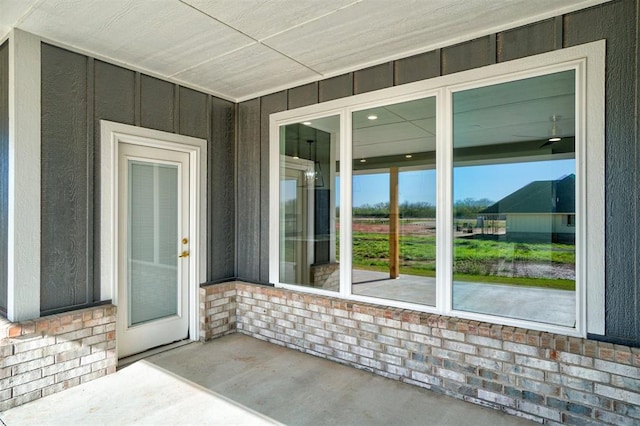 entrance to property with a patio