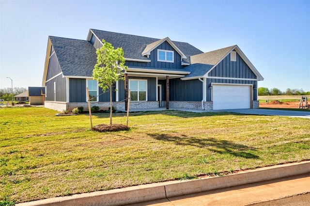 view of front of home featuring a garage and a front lawn