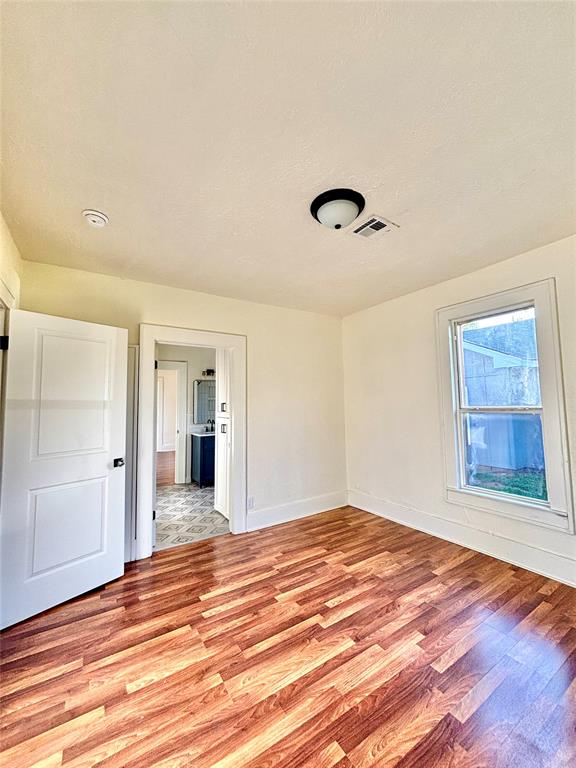 unfurnished room featuring light wood-type flooring