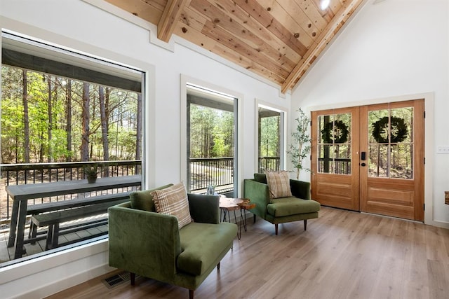 sunroom / solarium with french doors, vaulted ceiling with beams, and wood ceiling