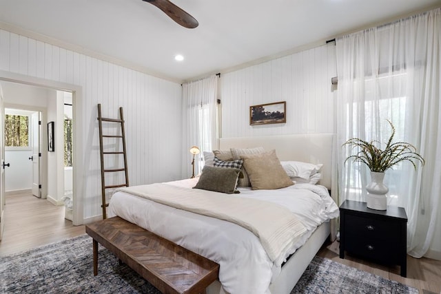 bedroom with wood-type flooring and ceiling fan