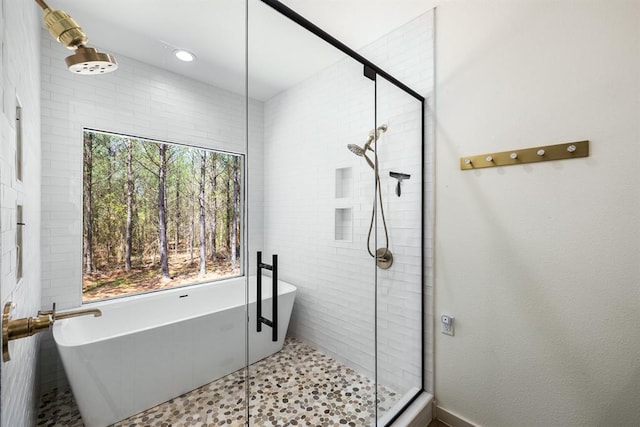 bathroom featuring plus walk in shower