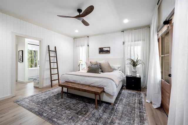 bedroom with hardwood / wood-style flooring and ceiling fan