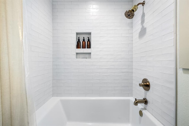 bathroom with shower / tub combo