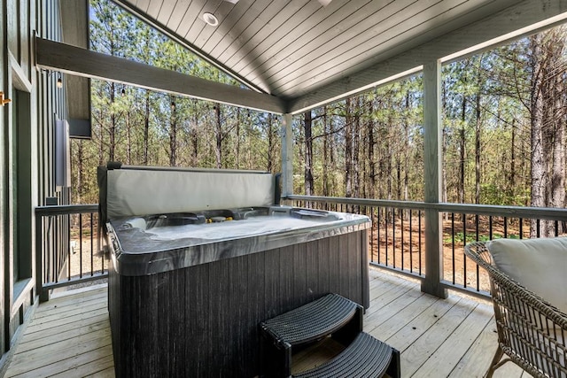 sunroom / solarium with lofted ceiling, wood ceiling, and a jacuzzi