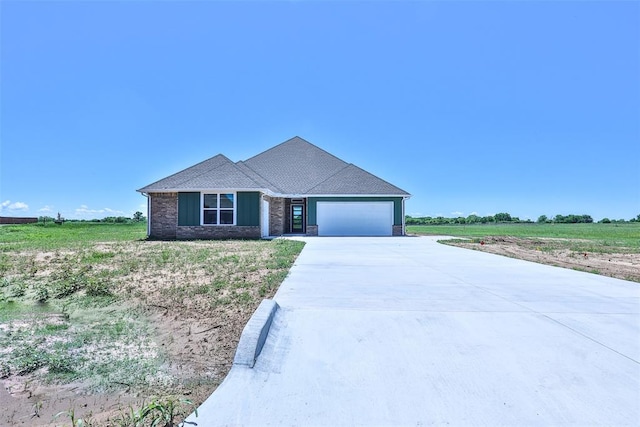 view of front of home featuring a rural view and a garage