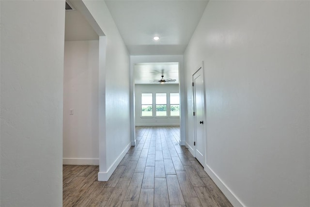 hallway with light wood-type flooring