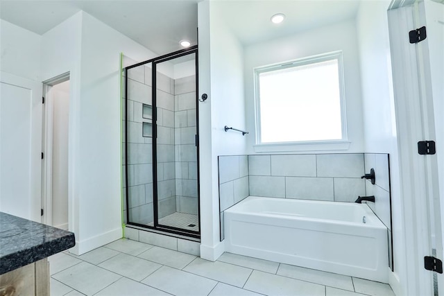 bathroom featuring separate shower and tub and tile patterned flooring