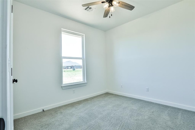 carpeted empty room with ceiling fan