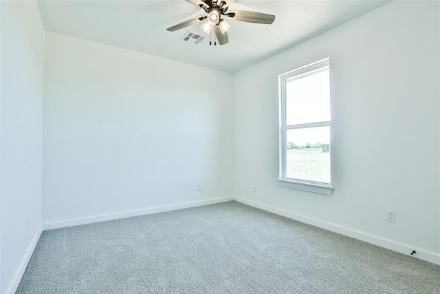 carpeted empty room featuring ceiling fan