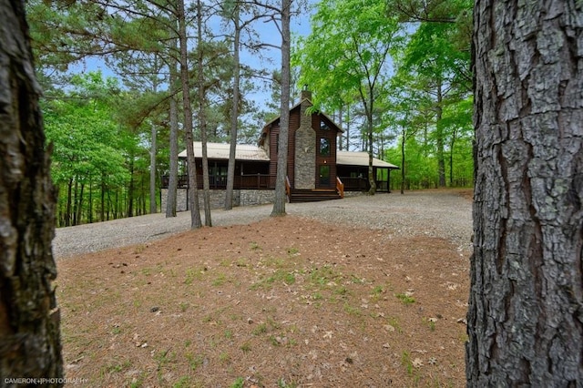 view of yard featuring covered porch