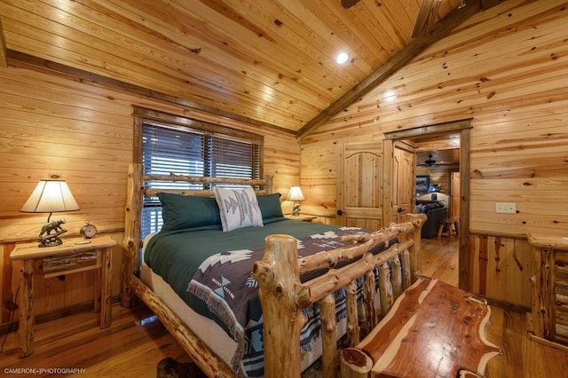 bedroom with wood walls, wood-type flooring, wood ceiling, and vaulted ceiling