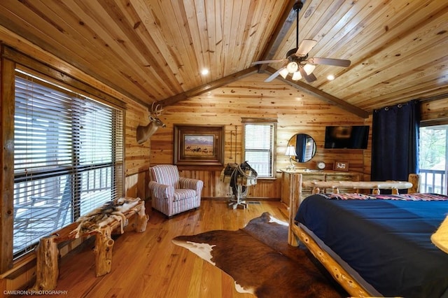 bedroom featuring wood ceiling, wooden walls, lofted ceiling with beams, and light wood-type flooring