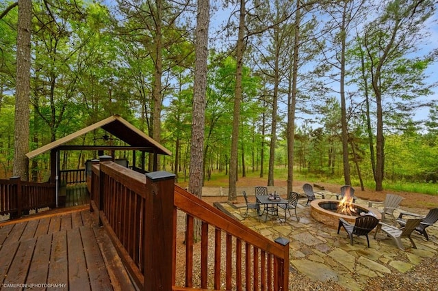 wooden deck with a fire pit