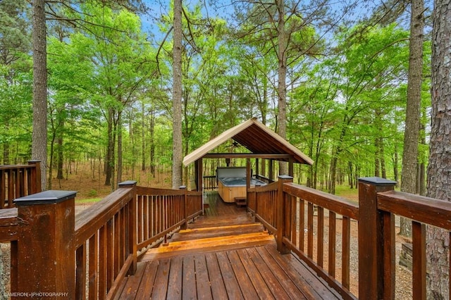 deck featuring a hot tub