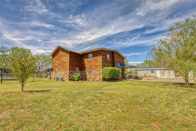 view of property exterior featuring a lawn, a patio area, and cooling unit