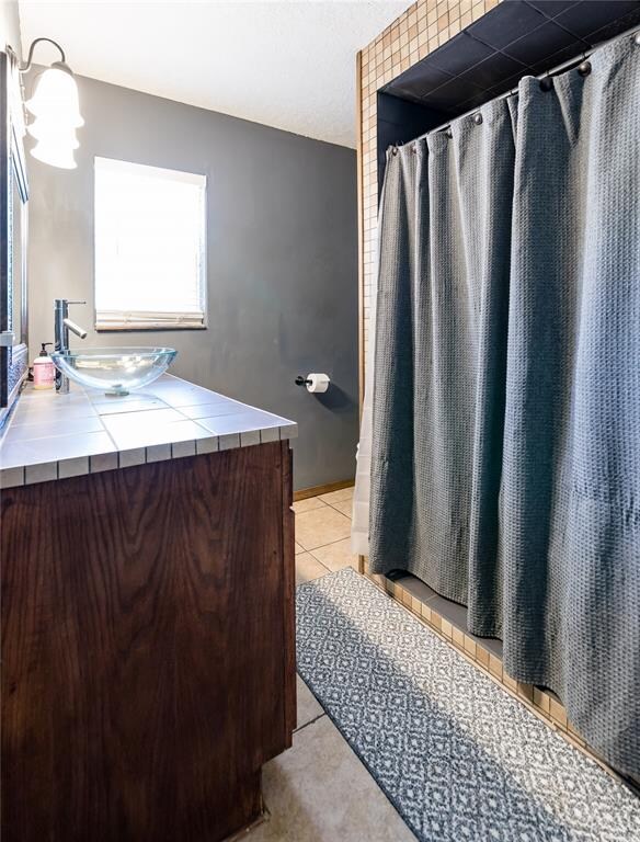 bathroom featuring tile patterned floors and vanity