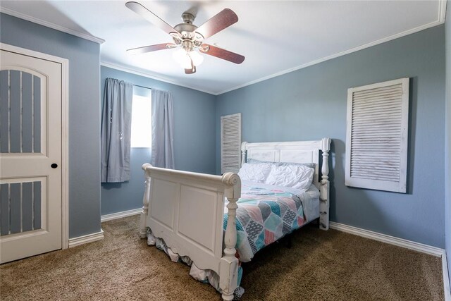 carpeted bedroom featuring ceiling fan and crown molding