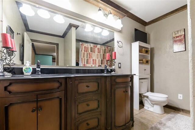 bathroom featuring crown molding, tile patterned flooring, vanity, and toilet