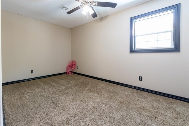 carpeted empty room with ceiling fan