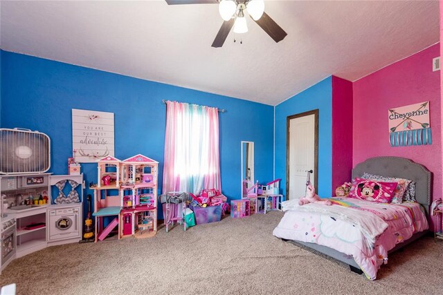 bedroom with carpet floors, vaulted ceiling, and ceiling fan