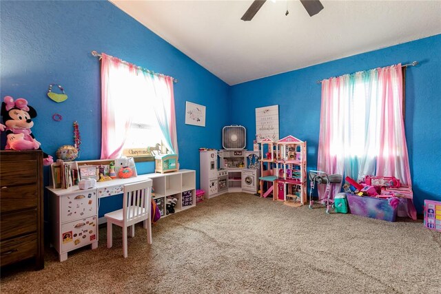 recreation room featuring carpet, plenty of natural light, and ceiling fan