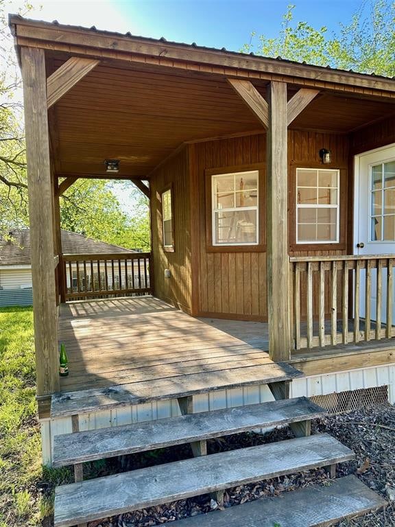 wooden terrace featuring a porch