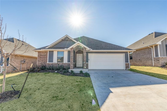 view of front of house with a front yard and a garage