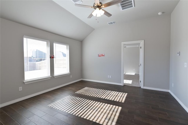 empty room with ceiling fan and vaulted ceiling