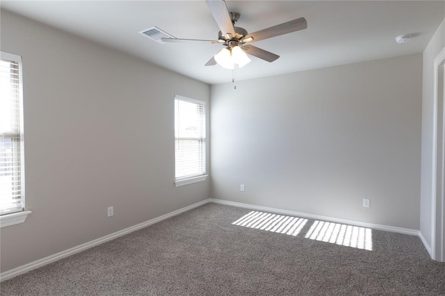 carpeted empty room with ceiling fan