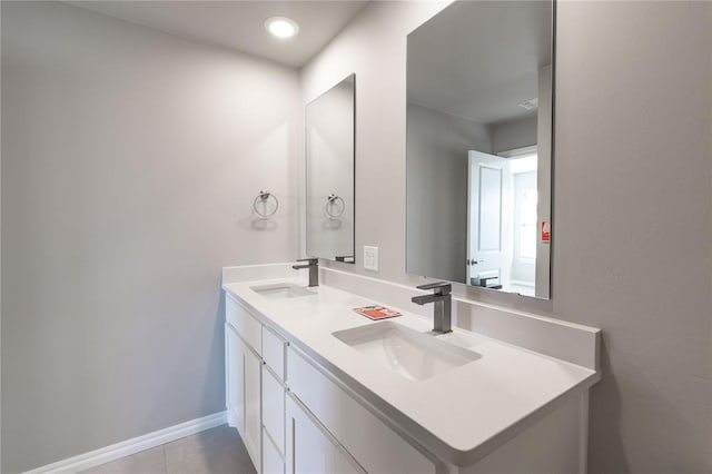 bathroom with tile patterned flooring and vanity