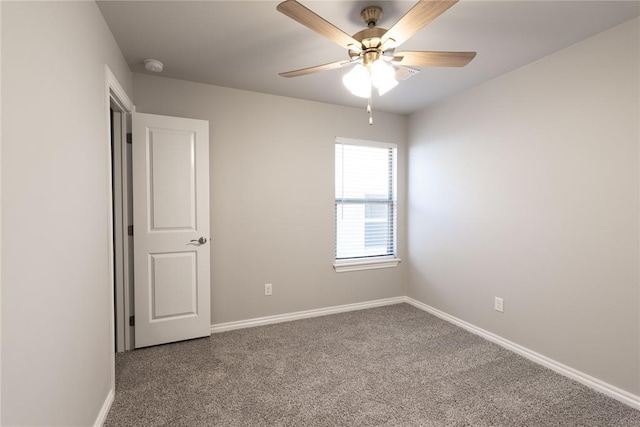 carpeted empty room featuring ceiling fan