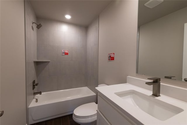 full bathroom with vanity, toilet, and tiled shower / bath