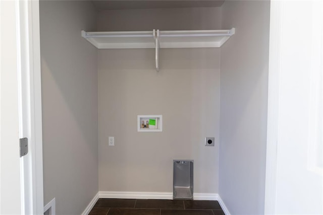 laundry area with washer hookup, electric dryer hookup, and dark tile patterned floors