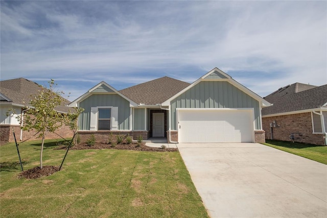 view of front of house featuring a garage and a front lawn