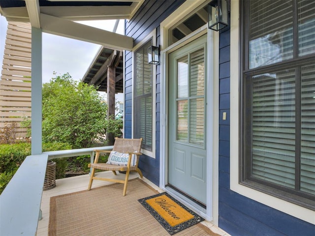 entrance to property featuring covered porch