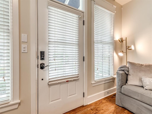 doorway with light wood-type flooring