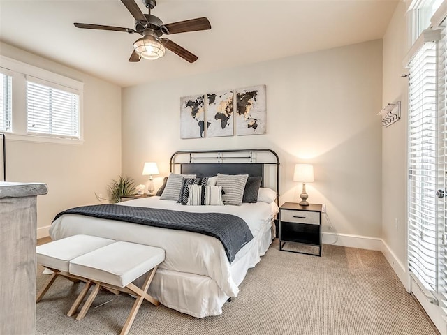 bedroom with ceiling fan and carpet