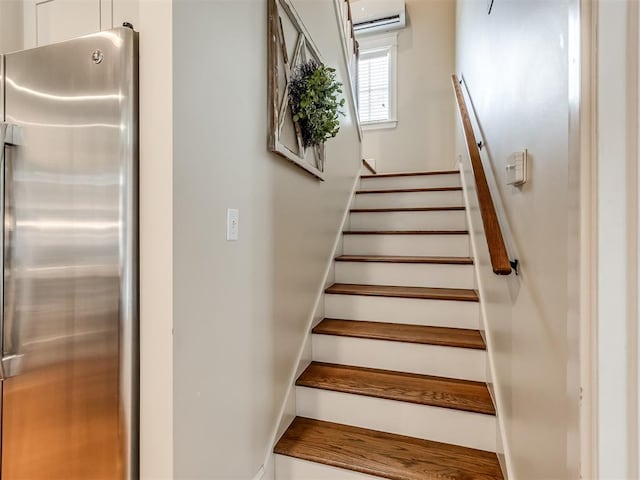 stairway with an AC wall unit