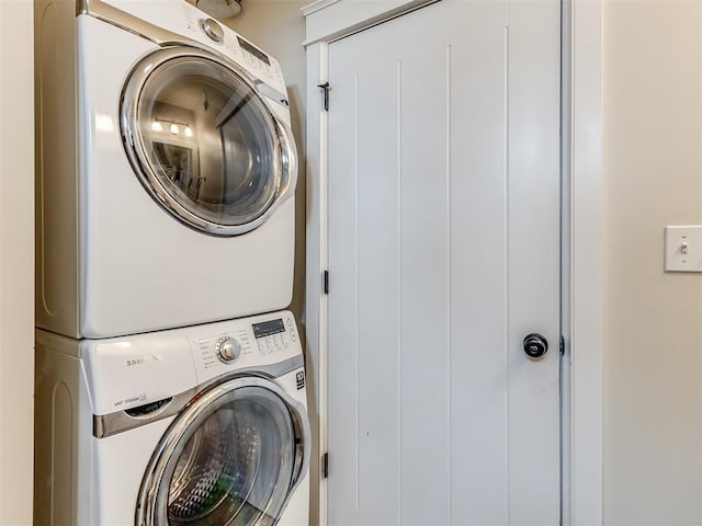 laundry room with stacked washer and clothes dryer