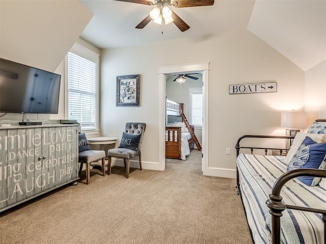 carpeted bedroom featuring ceiling fan and vaulted ceiling