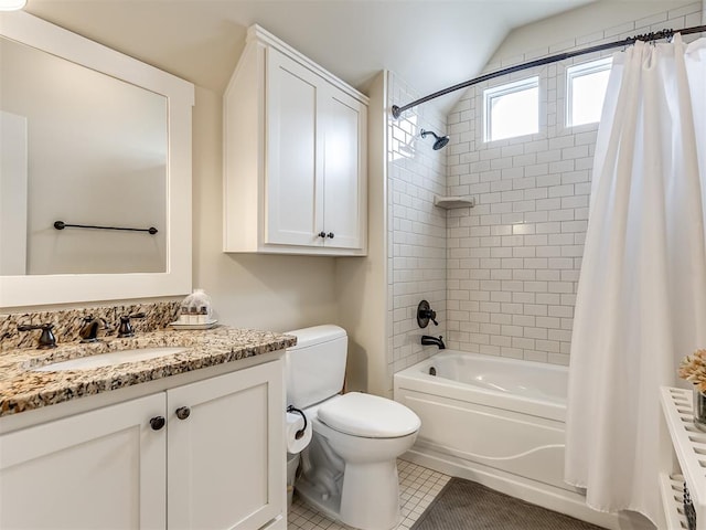 full bathroom with shower / bath combo, tile patterned flooring, lofted ceiling, toilet, and vanity