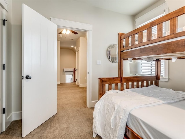 bedroom with ceiling fan and light colored carpet