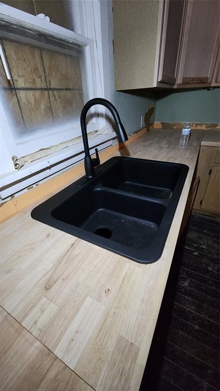 interior details with dark wood-type flooring and sink