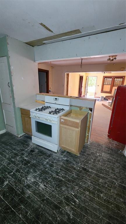 kitchen with white gas stove